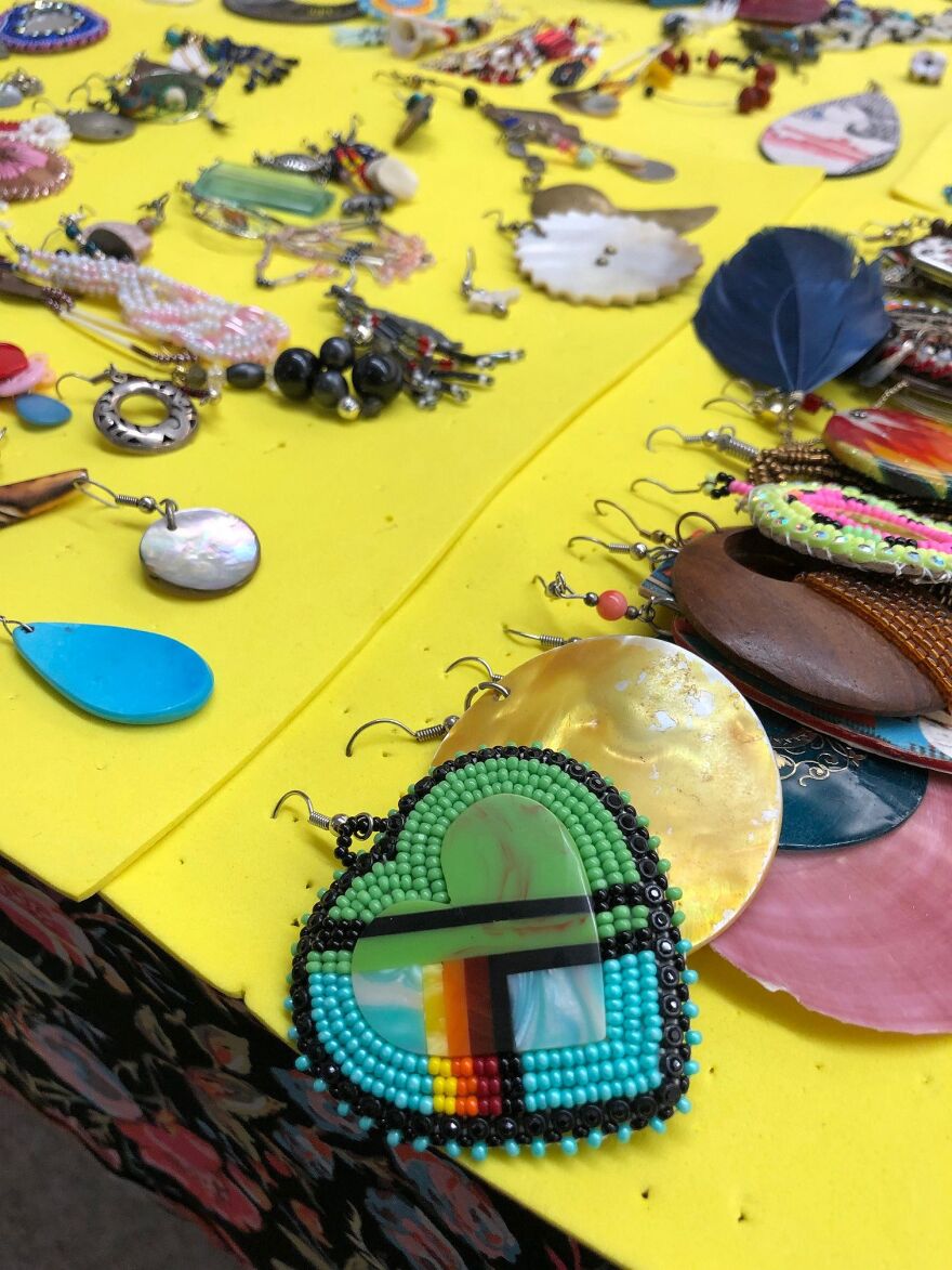 A table full of single-side earrings represents Canadian Aboriginal and Native American women who've been abducted or murdered. While no solid database has been kept in the U.S., Canadian records say the number of victims is at least 1,181.